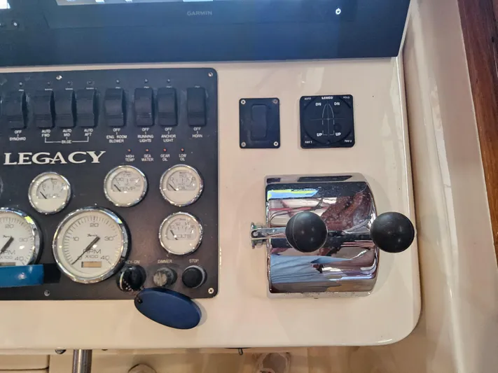 Lady One Yacht Photos Pics Control panel of 2003 Legacy 40 Hardtop Express with gauges and throttle levers.