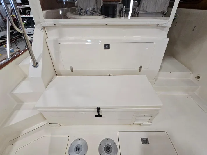 Lady One Yacht Photos Pics 2003 Legacy 40 Hardtop Express boat interior with storage compartments and seating area.