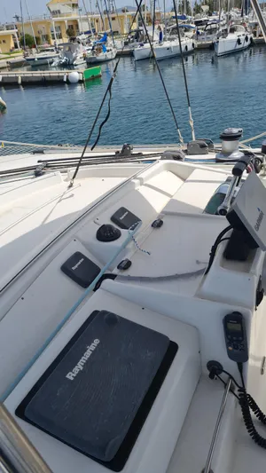  Yacht Photos Pics 2009 Lagoon 440 yacht helm with navigation equipment in a marina setting.