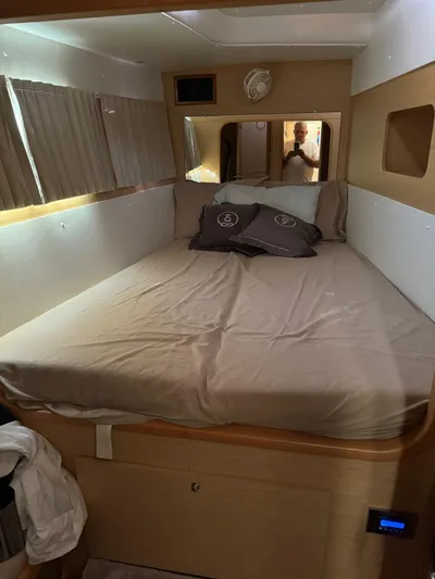  Yacht Photos Pics Interior cabin of 2009 Lagoon 440 catamaran with bed and pillows.