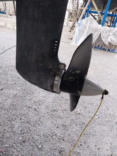  Yacht Photos Pics Propeller of 2009 Lagoon 440 catamaran on gravel surface.