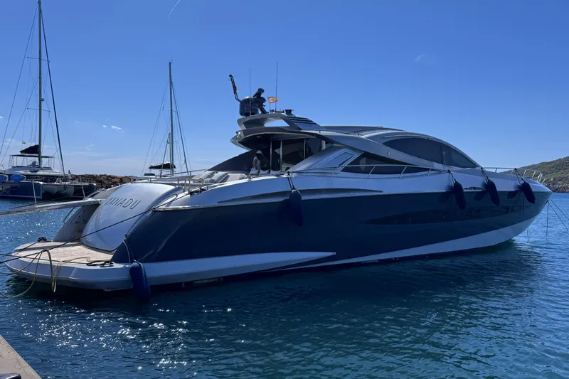  Yacht Photos Pics Luxurious 2010 Canados 90 yacht docked in a sunny marina.