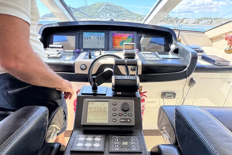  Yacht Photos Pics Cockpit of 2010 Canados 90 yacht with navigation equipment and scenic view.