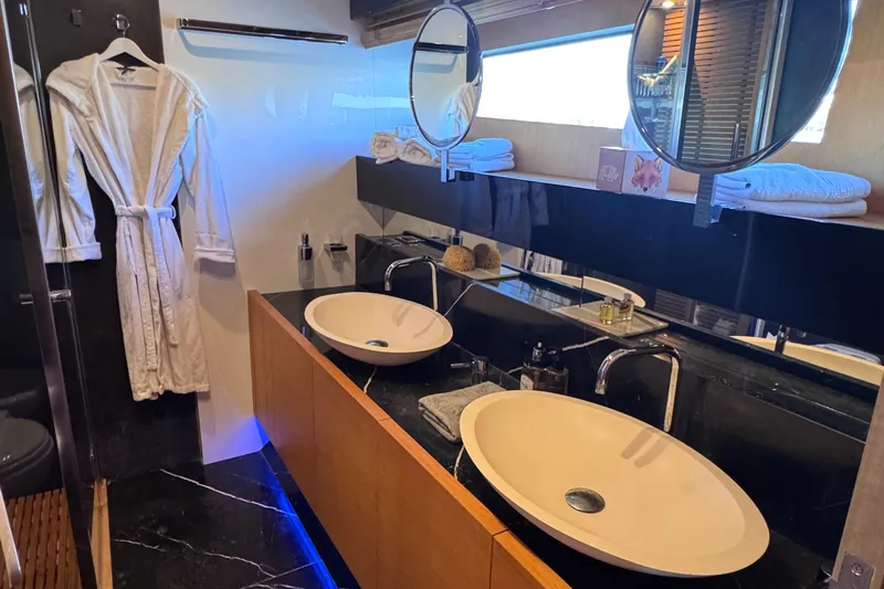  Yacht Photos Pics Luxurious bathroom in 2010 Canados 90 yacht with dual sinks and elegant decor.