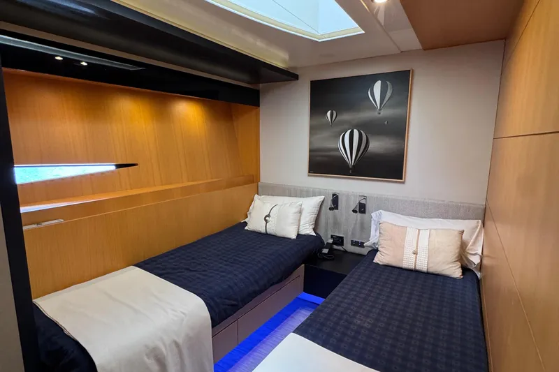  Yacht Photos Pics Luxurious twin cabin on 2010 Canados 90 yacht with modern decor and hot air balloon artwork.