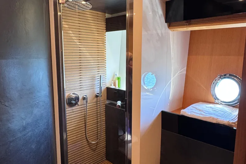  Yacht Photos Pics Luxurious bathroom in 2010 Canados 90 yacht with modern shower and porthole window.