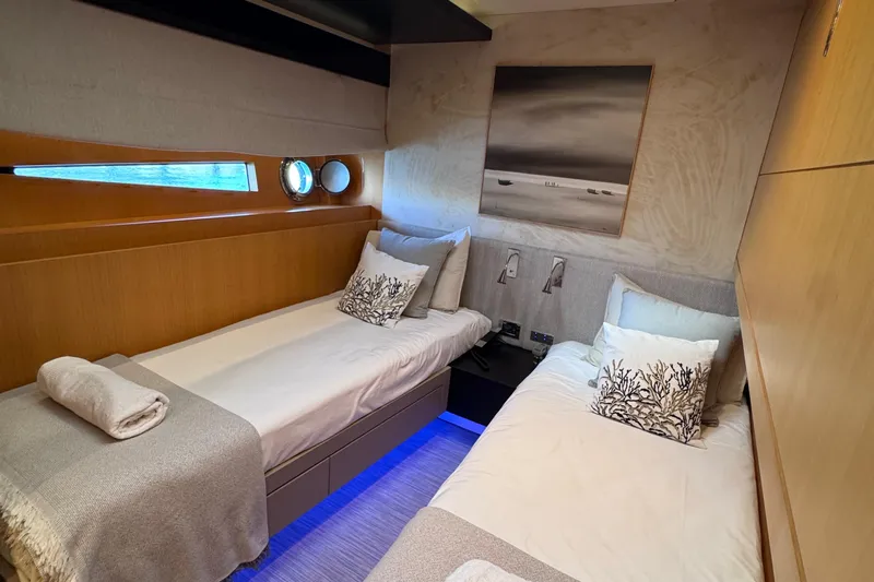  Yacht Photos Pics Luxurious twin cabin interior on a 2010 Canados 90 yacht, featuring modern decor and ambient lighting.
