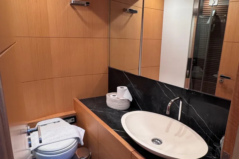  Yacht Photos Pics Luxurious bathroom in 2010 Canados 90 yacht with modern sink and wooden accents.