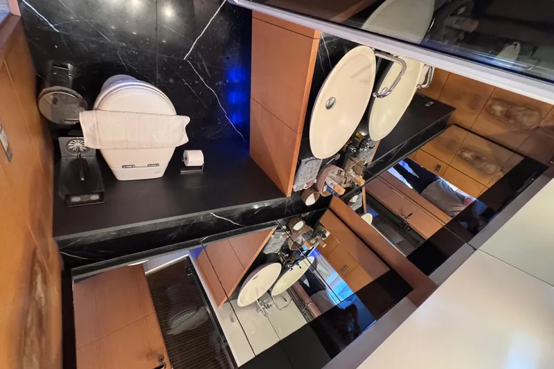  Yacht Photos Pics Luxurious bathroom interior on a 2010 Canados 90 yacht, featuring elegant fixtures and modern design.