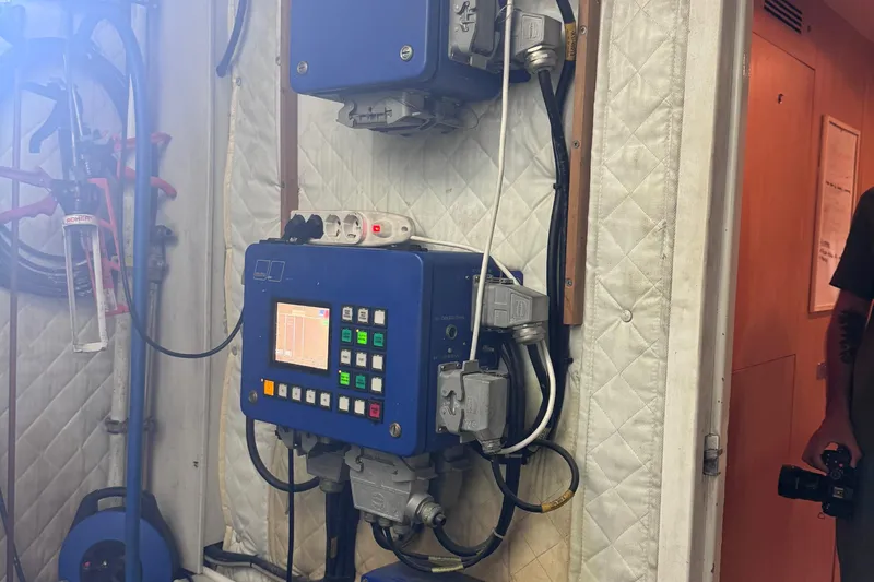  Yacht Photos Pics Control panel in a 2010 Canados 90 yacht engine room, featuring various buttons and cables.