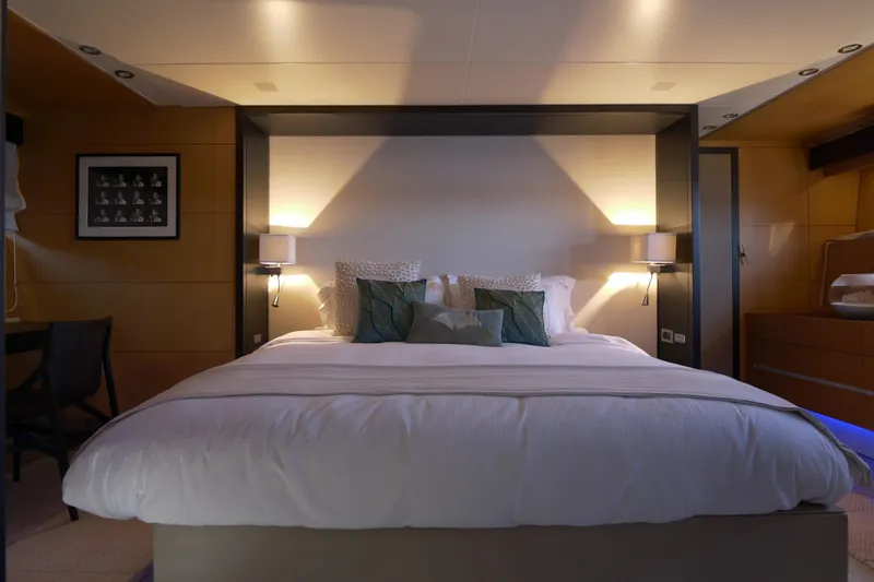  Yacht Photos Pics Luxurious bedroom interior on a 2010 Canados 90 yacht, featuring elegant lighting and modern decor.