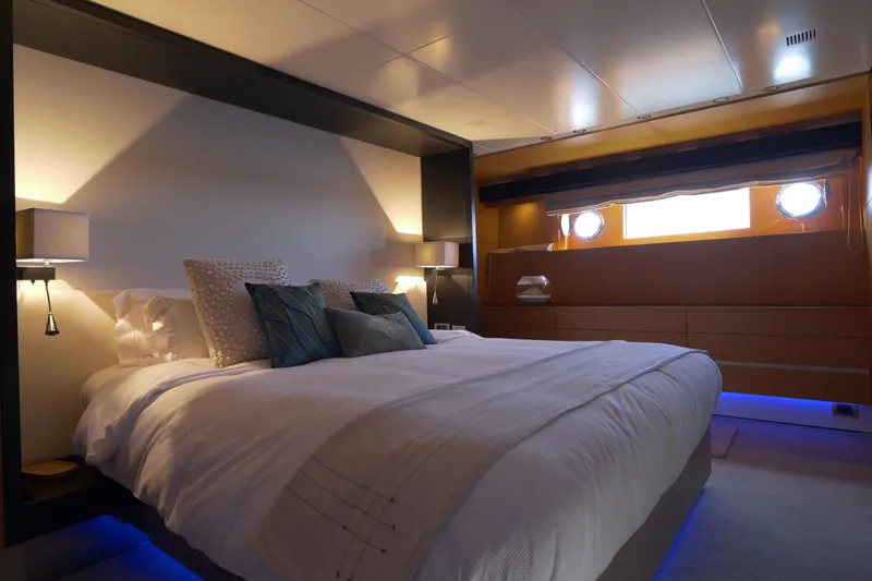  Yacht Photos Pics Luxurious bedroom interior on a 2010 Canados 90 yacht, featuring elegant lighting and modern design.