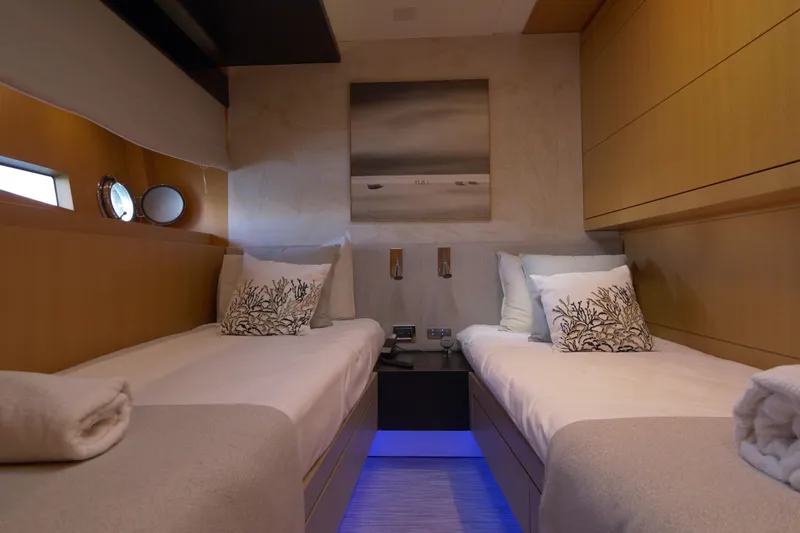  Yacht Photos Pics Luxurious twin cabin on 2010 Canados 90 yacht with modern decor and ambient lighting.