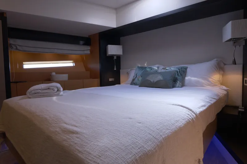  Yacht Photos Pics Luxurious bedroom interior of 2010 Canados 90 yacht with elegant bedding and soft lighting.