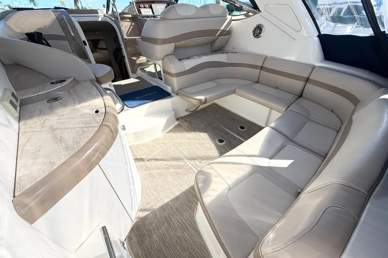 Game Changer Yacht Photos Pics 2016 Formula 37 Performance Cruiser interior with beige seating and modern design.