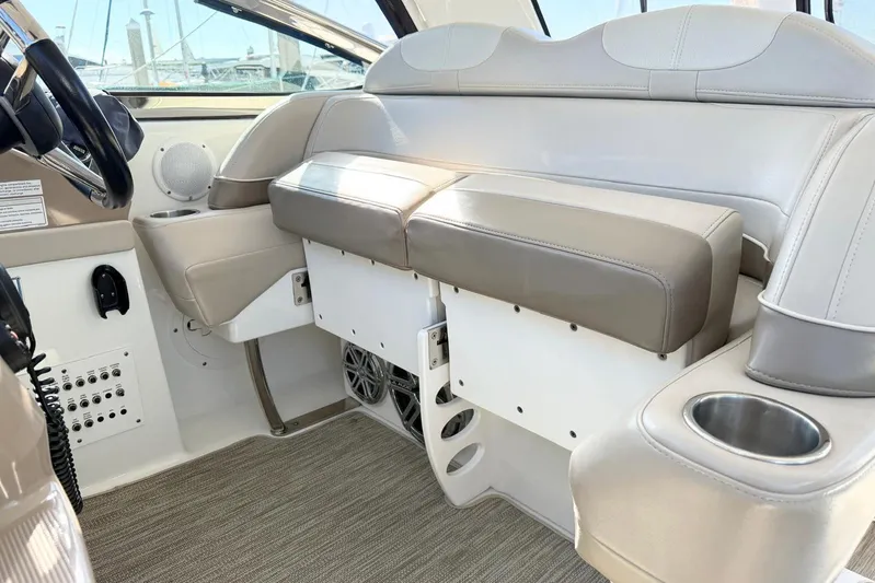 Game Changer Yacht Photos Pics Interior of a 2016 Formula 37 Performance Cruiser with beige seating and cup holders.