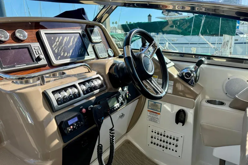 Game Changer Yacht Photos Pics Cockpit of 2016 Formula 37 Performance Cruiser with steering wheel and navigation controls.