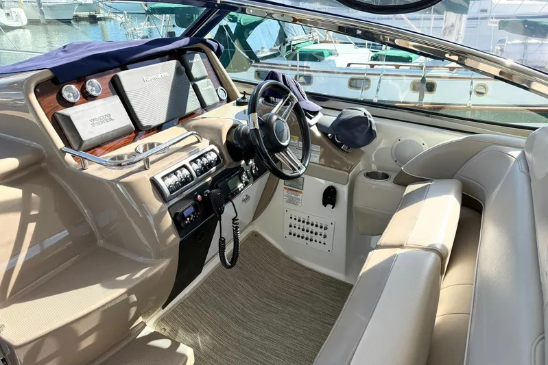 Game Changer Yacht Photos Pics 2016 Formula 37 Performance Cruiser cockpit with steering wheel and control panel.