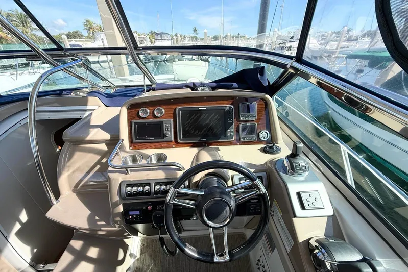 Game Changer Yacht Photos Pics 2016 Formula 37 Performance Cruiser helm with modern navigation controls and steering wheel.