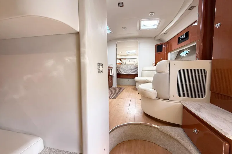 Game Changer Yacht Photos Pics Interior of 2016 Formula 37 Performance Cruiser, featuring modern seating and wood flooring.