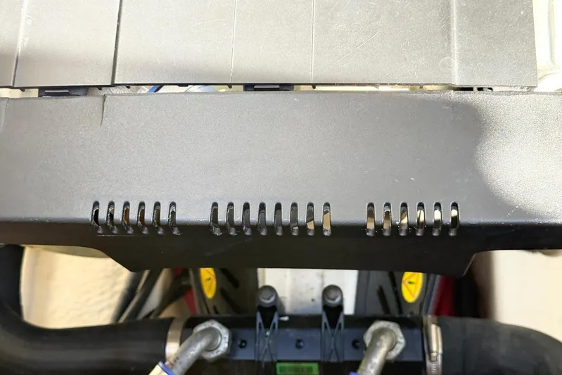 Game Changer Yacht Photos Pics Engine component of a 2016 Formula 37 Performance Cruiser with visible hoses and connectors.