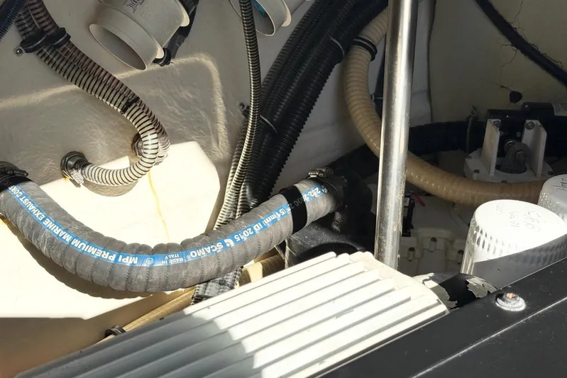 Game Changer Yacht Photos Pics Engine compartment of a 2016 Formula 37 Performance Cruiser with hoses and filters visible.