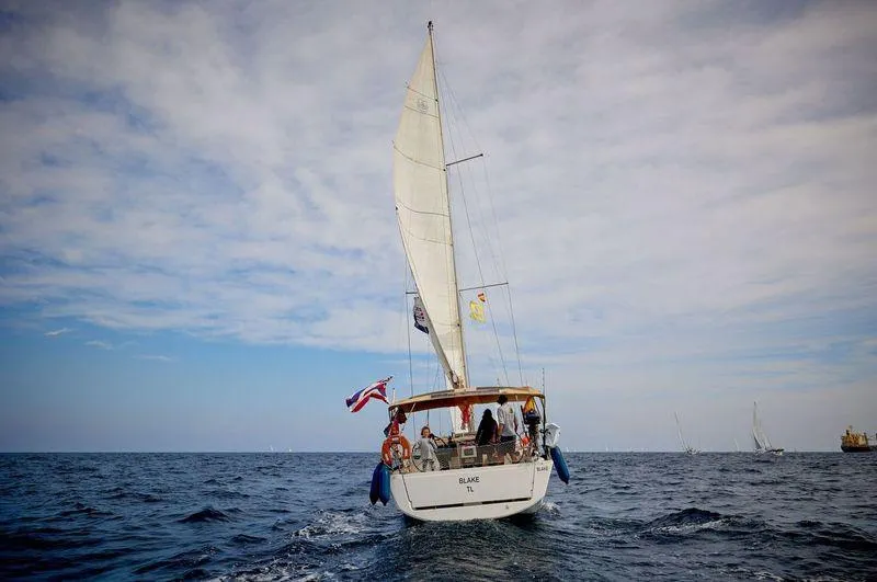 Blake Yacht Photos Pics Dufour 382 Grand Large 2016 sailing on open sea under cloudy sky.