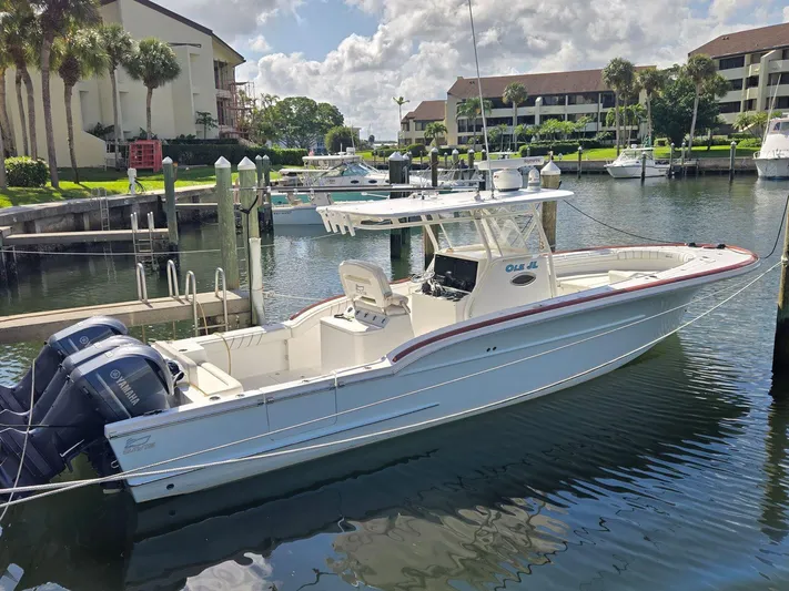  Yacht Photos Pics 2017 Custom Carolina Center Console boat docked in a marina, featuring twin Yamaha engines.