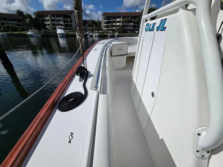  Yacht Photos Pics 2017 Custom Carolina Center Console boat docked at marina, clear sky, calm water.