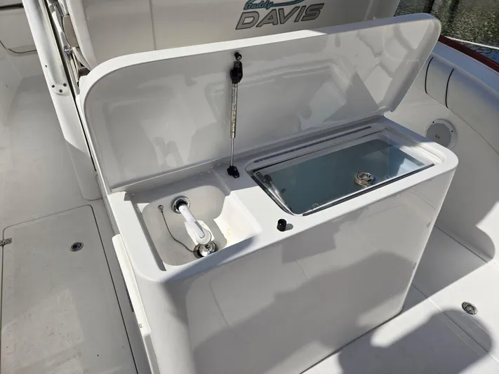  Yacht Photos Pics 2017 Custom Carolina Center Console boat with open storage compartment and sink.