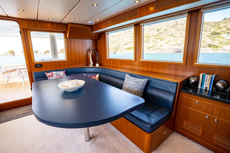  Yacht Photos Pics Luxurious 2018 Nordhavn 60 yacht interior with elegant dining area and scenic ocean views.