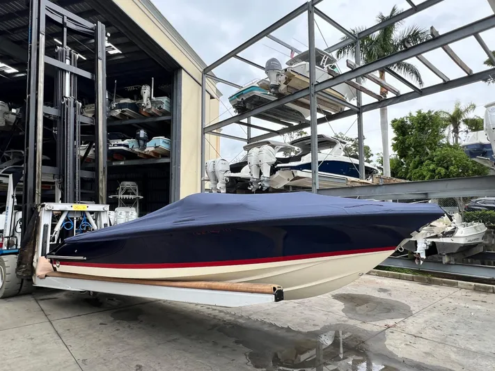  Yacht Photos Pics 2022 Chris-Craft Launch 27 boat in storage facility with cover.