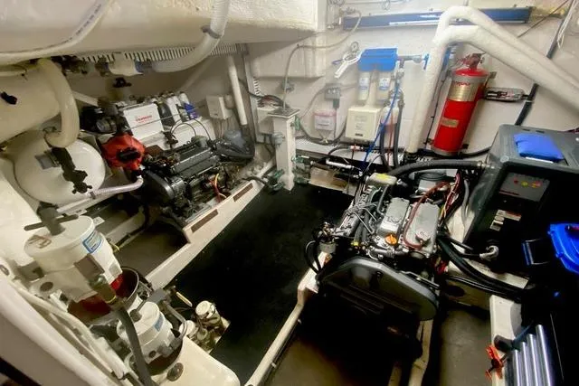 Ten Sigma (formerly Recently Korkzcrew) Yacht Photos Pics Engine room of 2008 Great Harbour N37 yacht, featuring mechanical equipment and fire extinguisher.