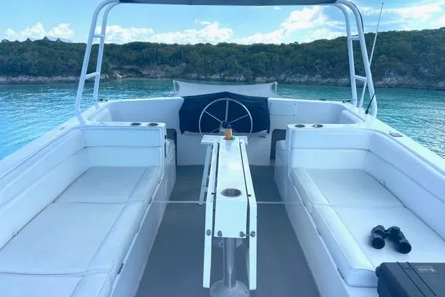 Ten Sigma (formerly Recently Korkzcrew) Yacht Photos Pics 2008 Great Harbour N37 boat interior with seating, table, and scenic water view.