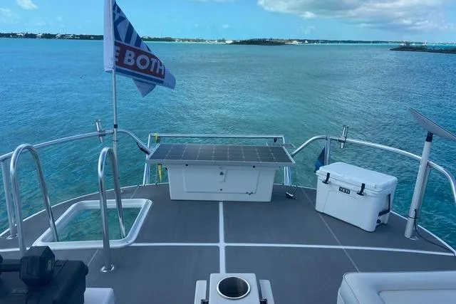 Ten Sigma (formerly Recently Korkzcrew) Yacht Photos Pics 2008 Great Harbour N37 yacht deck with solar panel, cooler, and ocean view.