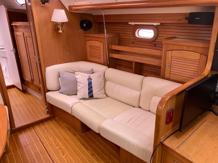  Yacht Photos Pics Luxurious interior of a 2008 Catalina 470 yacht with cream leather seating and wooden accents.