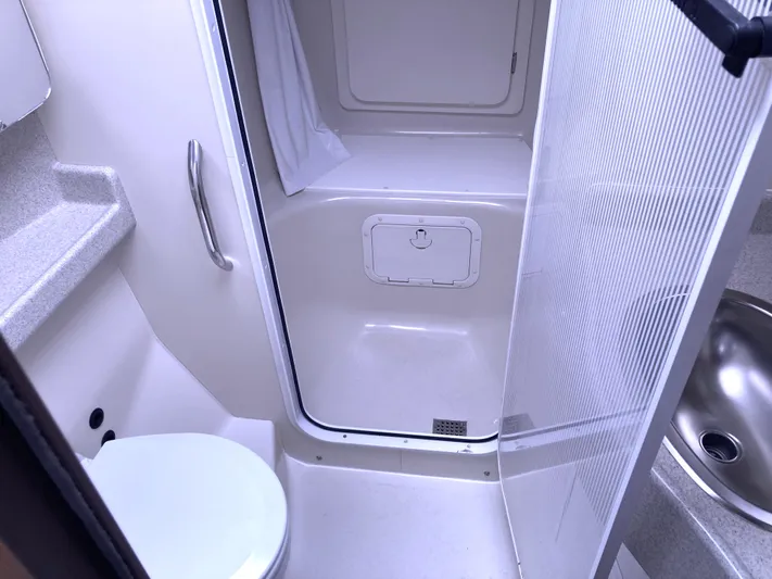  Yacht Photos Pics Bathroom interior of 2008 Catalina 470 yacht with shower, toilet, and sink.