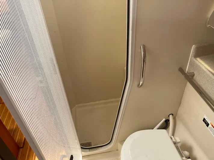  Yacht Photos Pics Bathroom interior of 2008 Catalina 470 yacht, featuring shower and toilet.