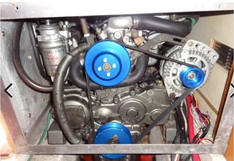  Yacht Photos Pics Engine compartment of a 2008 Catalina 470 sailboat, featuring visible belts and components.