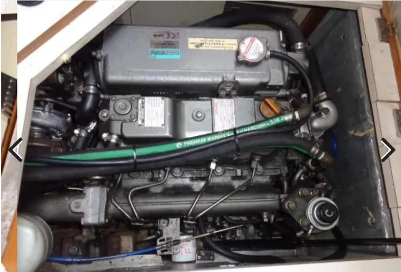  Yacht Photos Pics Engine compartment of a 2008 Catalina 470 sailboat, showcasing mechanical components and hoses.