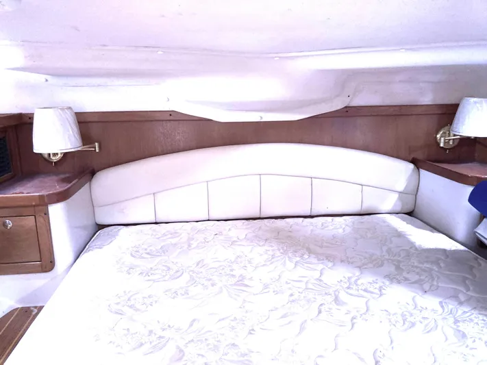  Yacht Photos Pics Luxurious cabin interior of 2008 Catalina 470 yacht with elegant bedding and wooden accents.