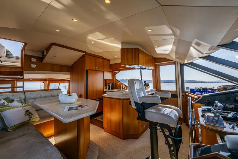 Kolokea Yacht Photos Pics Luxurious interior of 2001 West Bay 58 yacht with modern helm and seating.