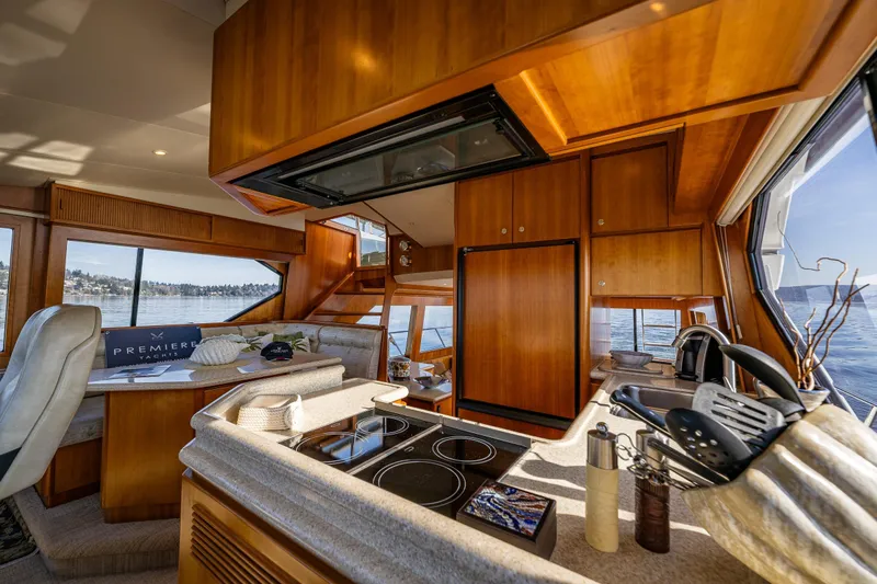 Kolokea Yacht Photos Pics Luxurious interior of 2001 West Bay 58 yacht with modern kitchen and scenic views.