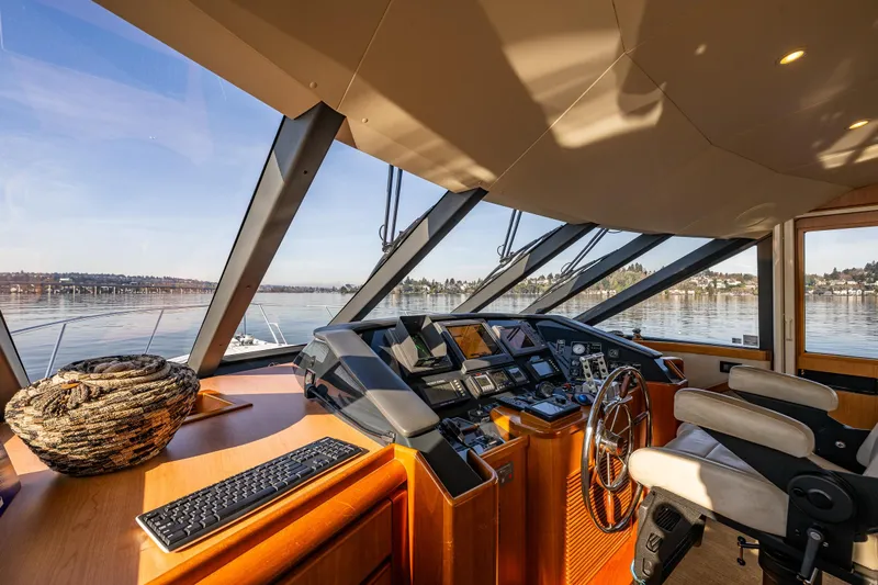 Kolokea Yacht Photos Pics Helm of 2001 West Bay 58 yacht with panoramic windows and modern controls.