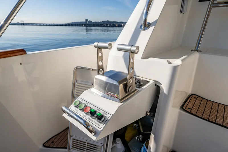 Kolokea Yacht Photos Pics Control panel of a 2001 West Bay 58 yacht with scenic water view.