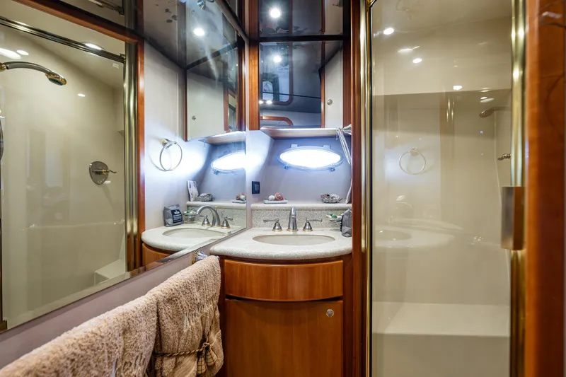 Kolokea Yacht Photos Pics Luxurious bathroom in 2001 West Bay 58 yacht with dual sinks and modern fixtures.