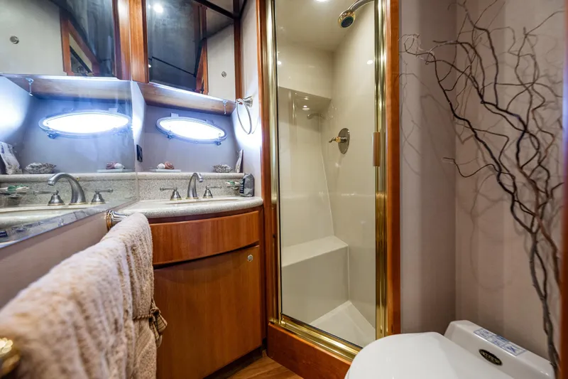 Kolokea Yacht Photos Pics Luxurious bathroom in 2001 West Bay 58 yacht with shower and vanity.