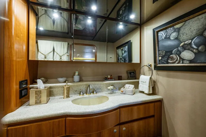 Kolokea Yacht Photos Pics Luxurious bathroom in 2001 West Bay 58 yacht with elegant decor and modern fixtures.
