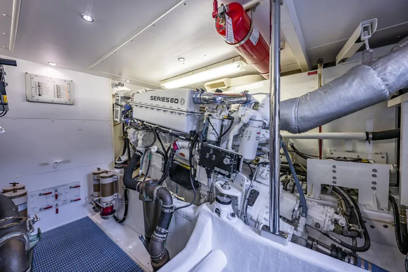 Kolokea Yacht Photos Pics Engine room of 2001 West Bay 58 yacht featuring Series 60 engine and fire extinguisher.