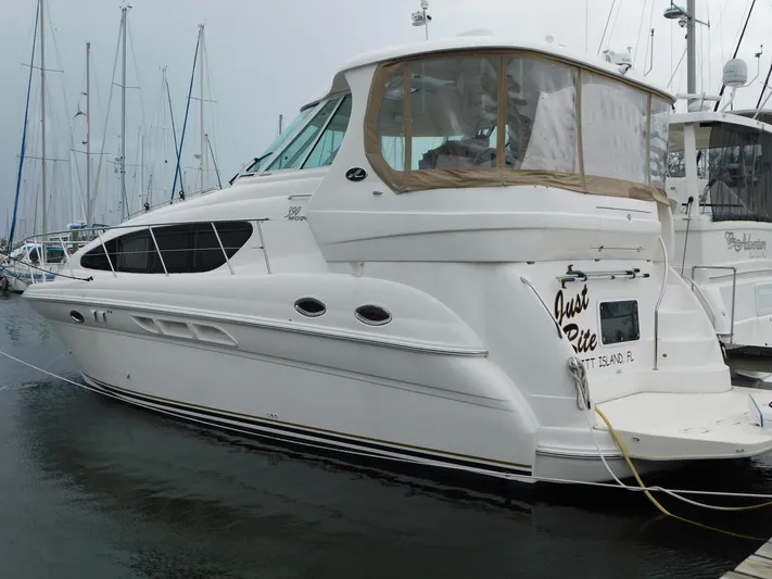 Just Rite Yacht Photos Pics 2004 Sea Ray 390 Motor Yacht docked in a marina, side view.